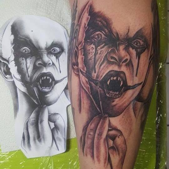 Fertiges Dämonen-Gesichtstattoo am Unterarm